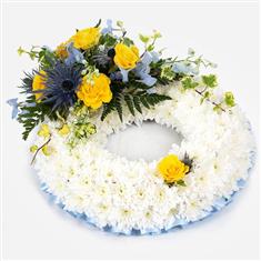 White Massed Wreath With Blue and Yellow Spray
